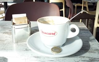 What is the customary tipping amount at restaurants in Rome, Italy?